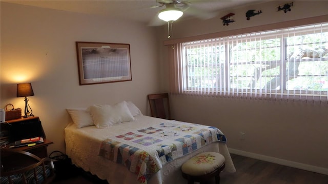 bedroom featuring hardwood / wood-style floors and ceiling fan