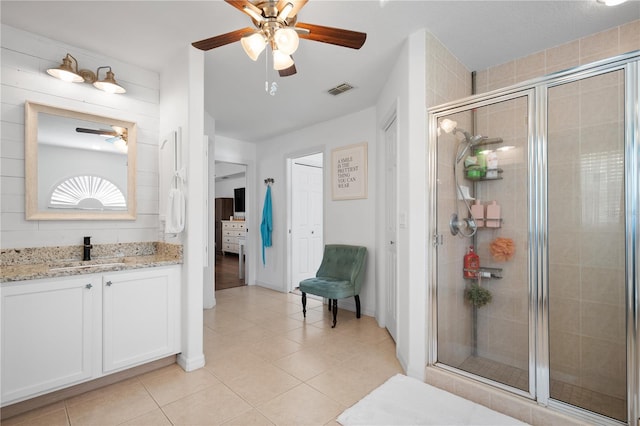 bathroom featuring vanity, an enclosed shower, tile patterned floors, and ceiling fan