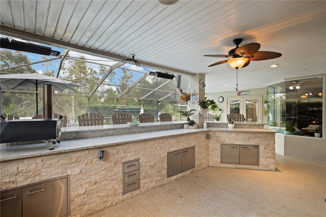 view of patio / terrace with ceiling fan and area for grilling