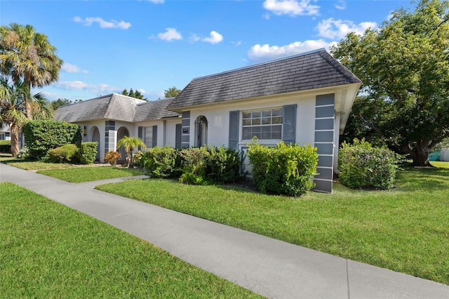 view of front of property with a front lawn