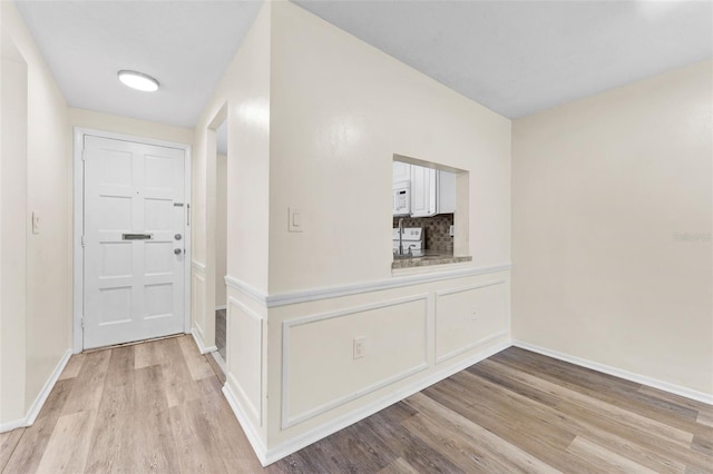 4220 Sheldon Pl Unit 4220, New Port Richey, FL 34652 - foyer with light wood finished floors and baseboards