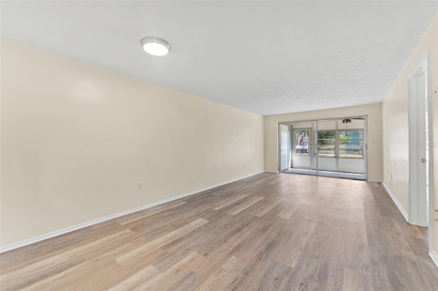 4220 Sheldon Pl Unit 4220, New Port Richey, FL 34652 - spare room featuring light wood finished floors and baseboards
