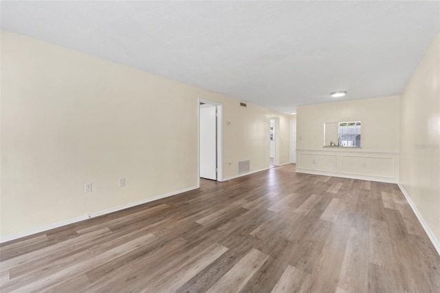 4220 Sheldon Pl Unit 4220, New Port Richey, FL 34652 - unfurnished living room with light wood-style flooring and baseboards