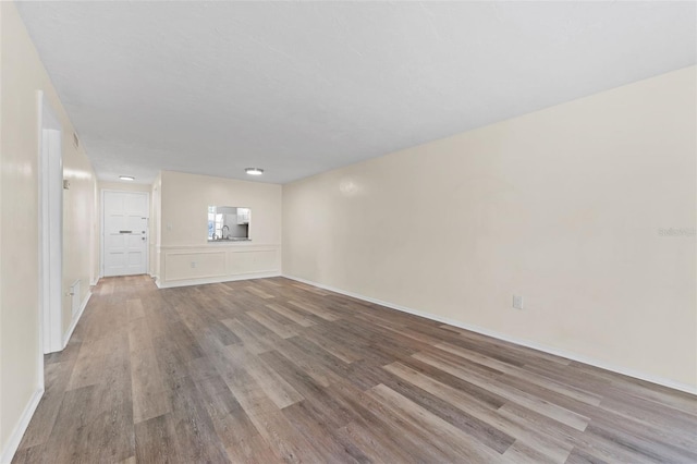4220 Sheldon Pl Unit 4220, New Port Richey, FL 34652 - unfurnished living room with wood finished floors and baseboards