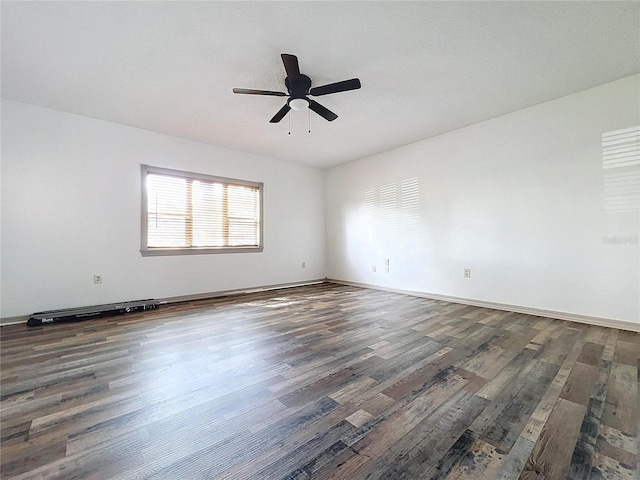 unfurnished room featuring dark hardwood / wood-style flooring and ceiling fan