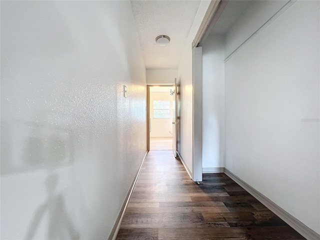 corridor with dark wood-type flooring