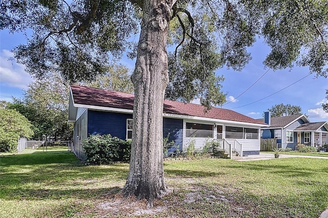 single story home featuring a front yard