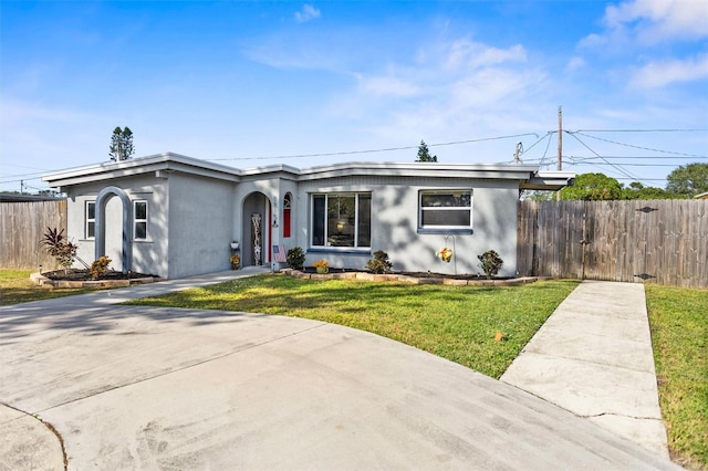 ranch-style house with a front lawn