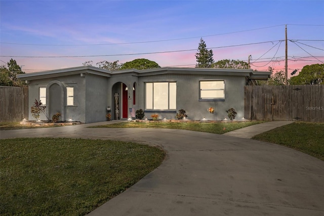 view of front of property with a lawn