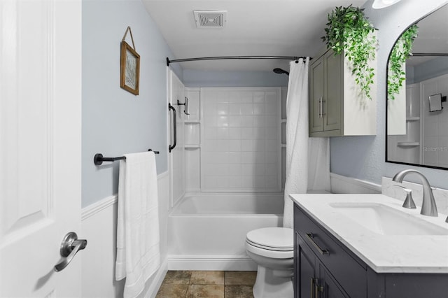 full bathroom featuring tile patterned flooring, vanity, shower / tub combo with curtain, and toilet