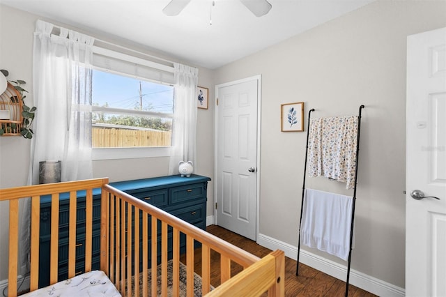 bedroom featuring ceiling fan and dark hardwood / wood-style flooring