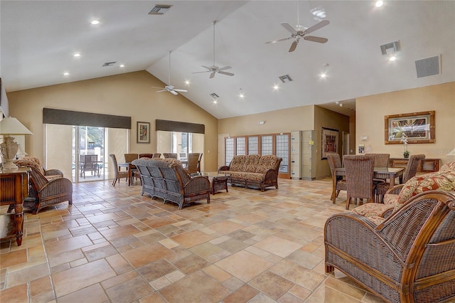 living room with ceiling fan and high vaulted ceiling