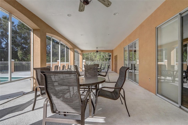 sunroom / solarium with ceiling fan