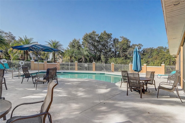 view of swimming pool featuring a patio area