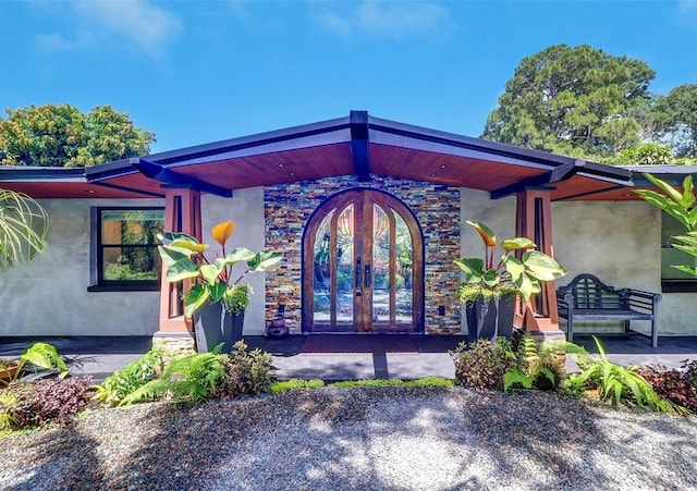 property entrance featuring french doors