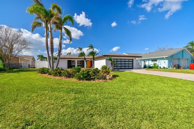 ranch-style house with a front lawn and a garage