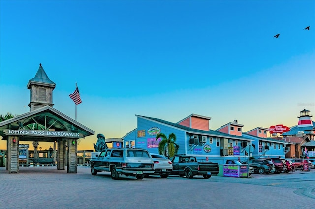 view of outdoor building at dusk