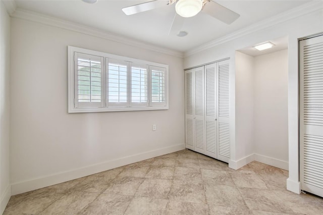 11683 Grove St, Seminole, FL 33772 - unfurnished bedroom featuring two closets, ornamental molding, and ceiling fan