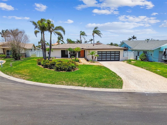 11683 Grove St, Seminole, FL 33772 - ranch-style home featuring a garage, driveway, and stucco siding
