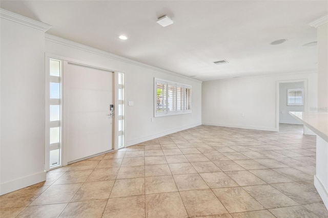 11683 Grove St, Seminole, FL 33772 - entryway with ornamental molding, light tile patterned floors, and recessed lighting