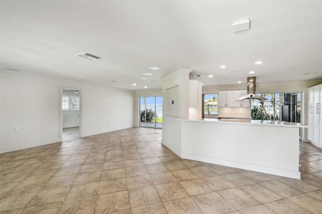11683 Grove St, Seminole, FL 33772 - unfurnished living room with recessed lighting, ornamental molding, and light tile patterned flooring