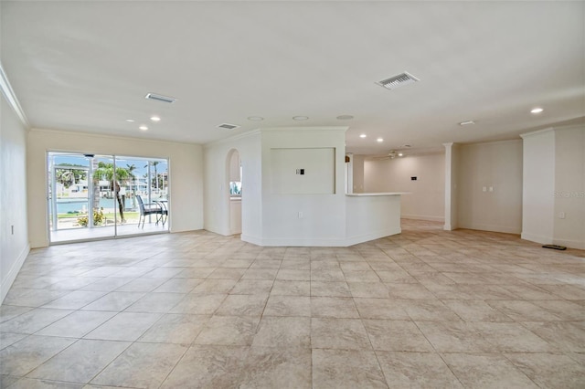 11683 Grove St, Seminole, FL 33772 - unfurnished living room with ornamental molding, arched walkways, recessed lighting, and light tile patterned floors