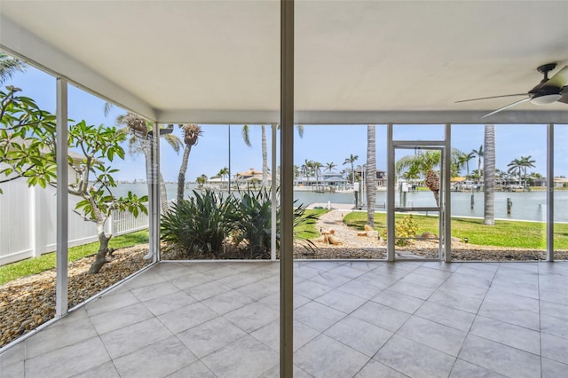 11683 Grove St, Seminole, FL 33772 - unfurnished sunroom featuring a water view and ceiling fan