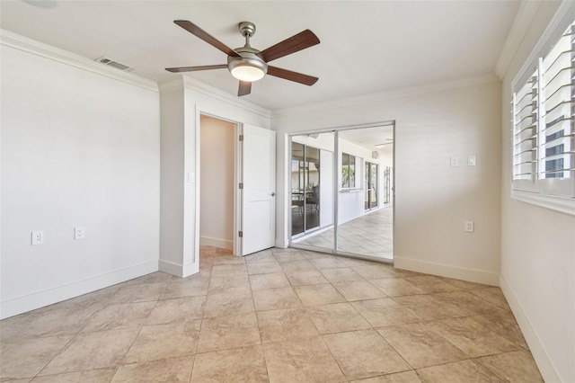 11683 Grove St, Seminole, FL 33772 - empty room with ceiling fan, ornamental molding, and light tile patterned flooring