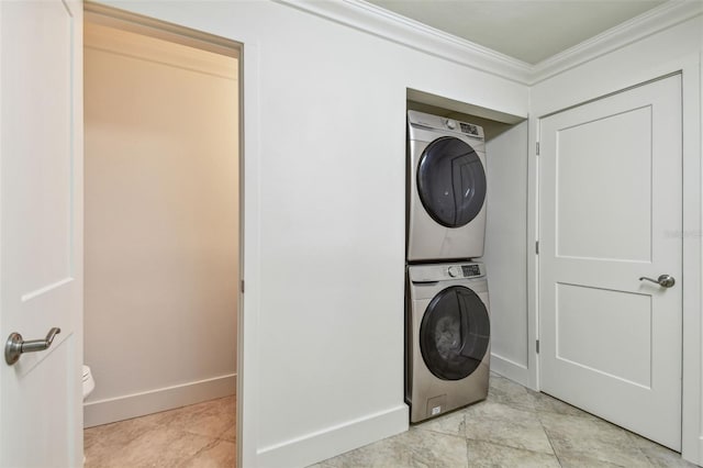 11683 Grove St, Seminole, FL 33772 - laundry area with stacked washer / drying machine and crown molding
