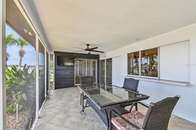 11683 Grove St, Seminole, FL 33772 - sunroom with plenty of natural light, ceiling fan, and outdoor dining area