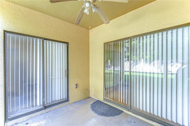 property entrance featuring ceiling fan