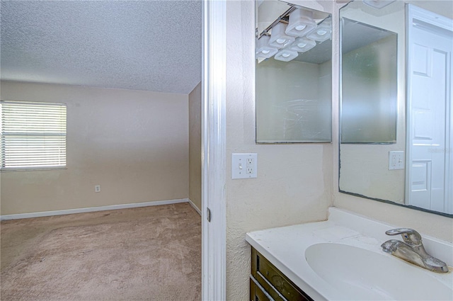 bathroom featuring vanity and a textured ceiling