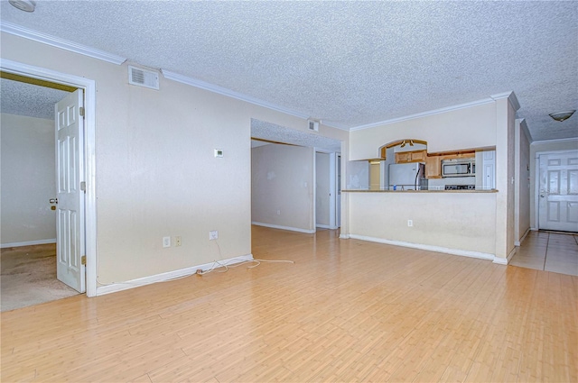 unfurnished living room with crown molding, a textured ceiling, and light hardwood / wood-style flooring