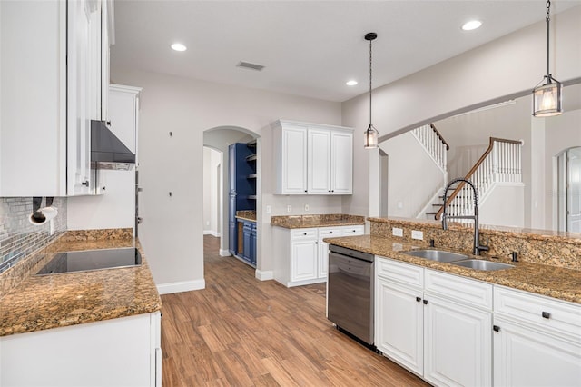 kitchen with decorative light fixtures, white cabinetry, stainless steel dishwasher, and black electric cooktop