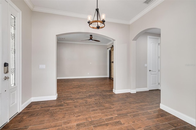 interior space with ceiling fan with notable chandelier, dark hardwood / wood-style flooring, and ornamental molding