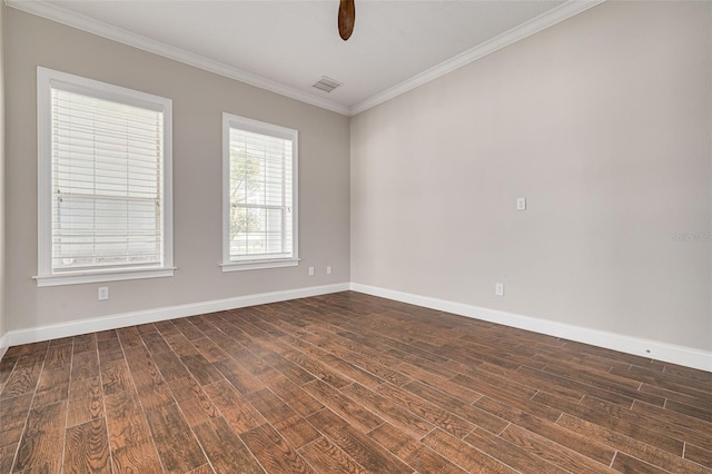 empty room featuring crown molding, ceiling fan, and dark wood-type flooring