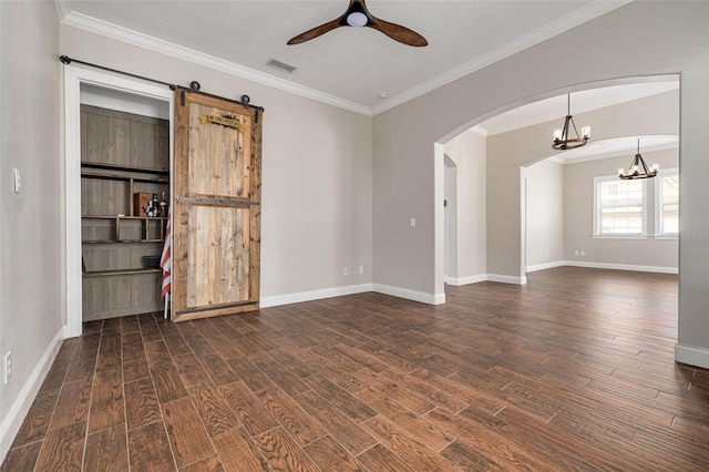 unfurnished room with ceiling fan with notable chandelier, ornamental molding, a barn door, and dark wood-type flooring