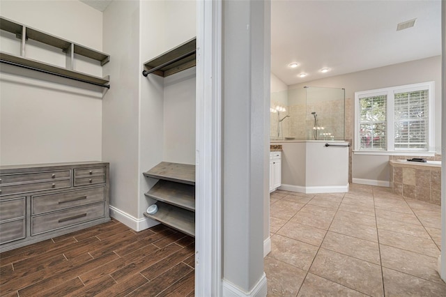 walk in closet featuring hardwood / wood-style floors