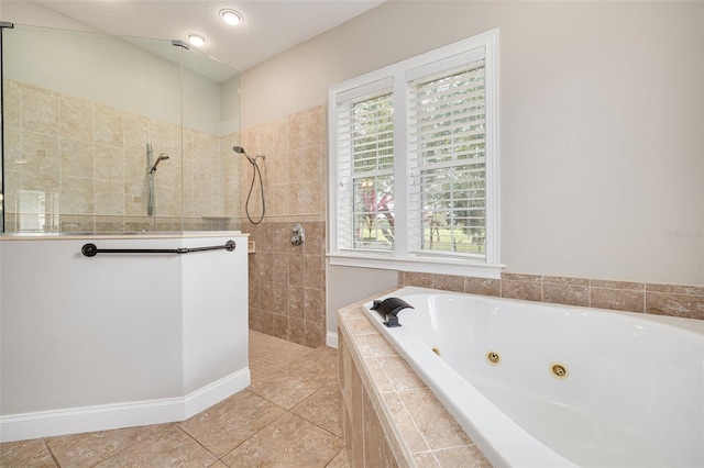 bathroom featuring tile patterned floors and separate shower and tub