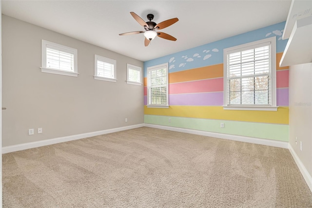 unfurnished room featuring carpet floors and ceiling fan