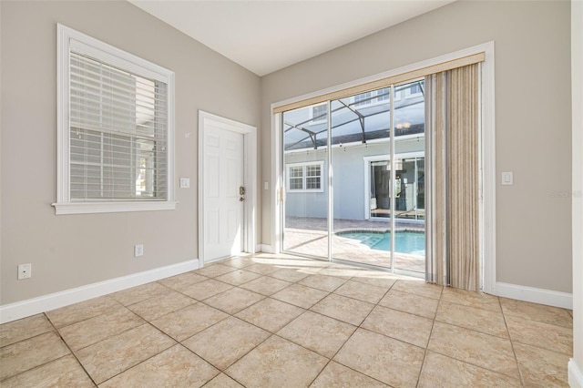 unfurnished room featuring light tile patterned floors