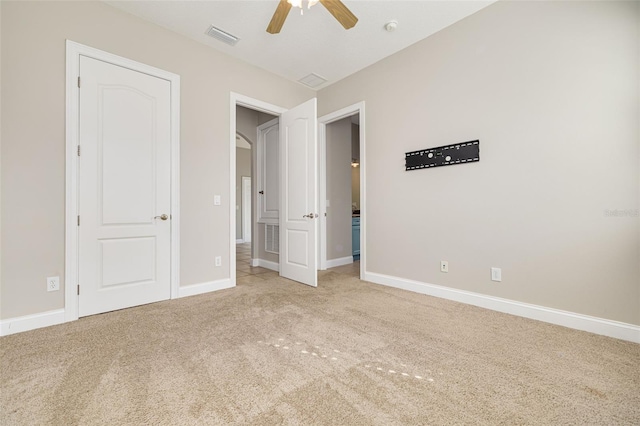 unfurnished bedroom with light carpet and ceiling fan