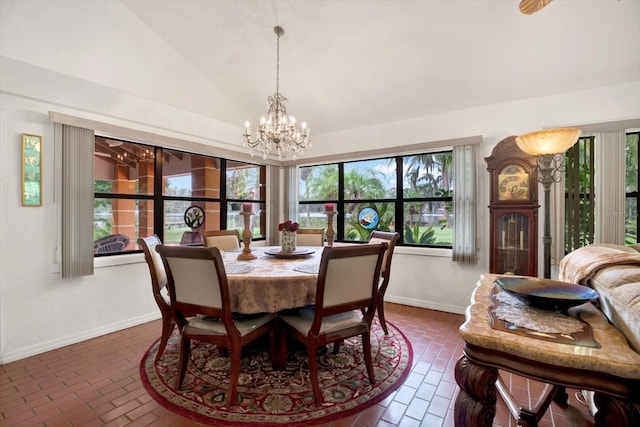 dining room featuring brick floor, baseboards, vaulted ceiling, and a notable chandelier