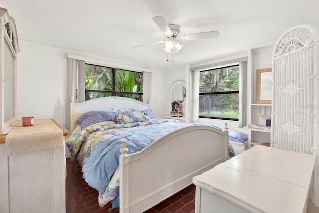 bedroom with brick floor and ceiling fan