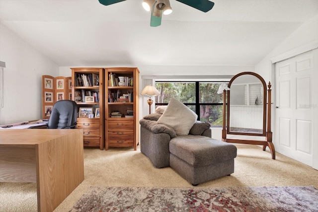 office space with light carpet, vaulted ceiling, and a ceiling fan