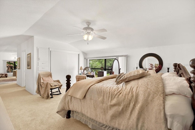 bedroom featuring ceiling fan, carpet, vaulted ceiling, and a closet