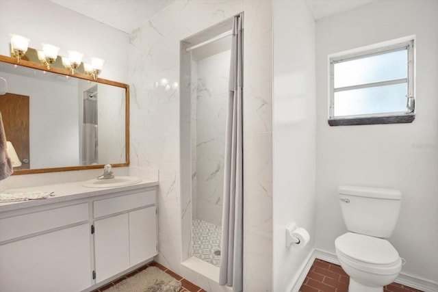 full bathroom featuring toilet, a marble finish shower, baseboards, and vanity