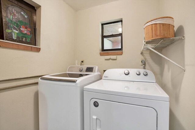 washroom with laundry area and washing machine and dryer