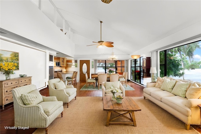 20333 Moss Branch Ct, Lutz, FL 33558 - living area with ceiling fan with notable chandelier, high vaulted ceiling, a wealth of natural light, and light wood-type flooring