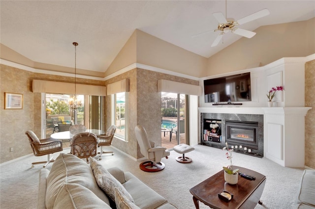 carpeted living room with high vaulted ceiling and ceiling fan